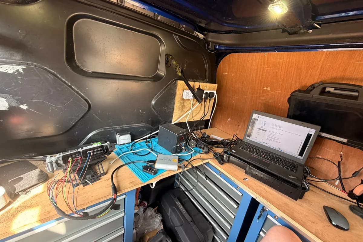 A diesel van connected to diagnostic equipment during an AdBlue system repair