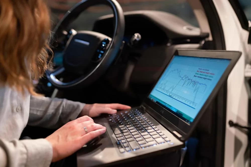 A laptop running live tuning data plugged into a car
